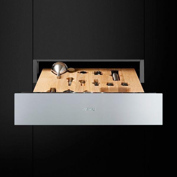 Stainless steel kitchen drawer open with wooden insert